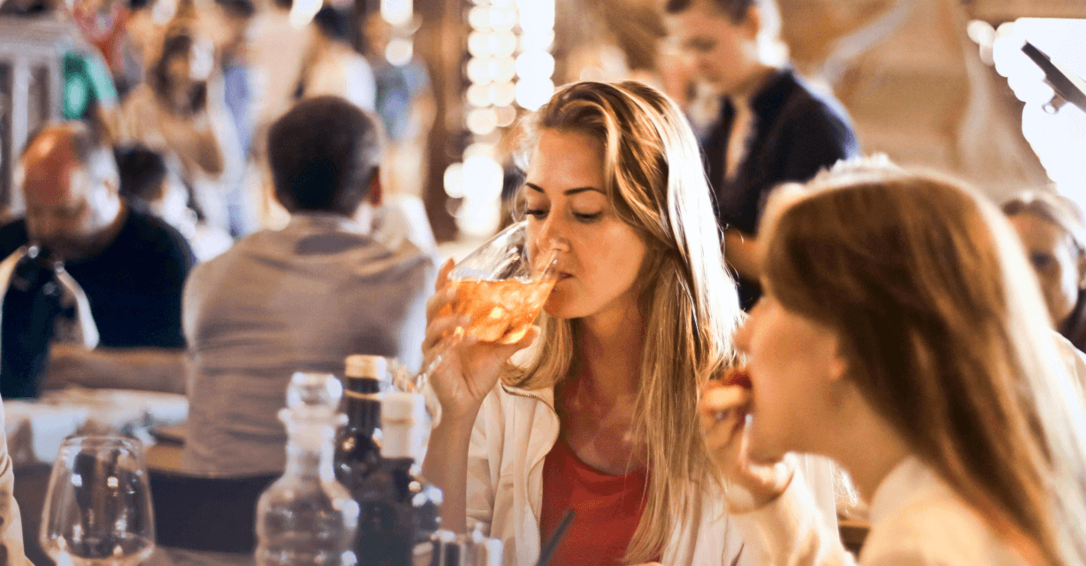 Visitors enjoying dinner together in a restaurant.
