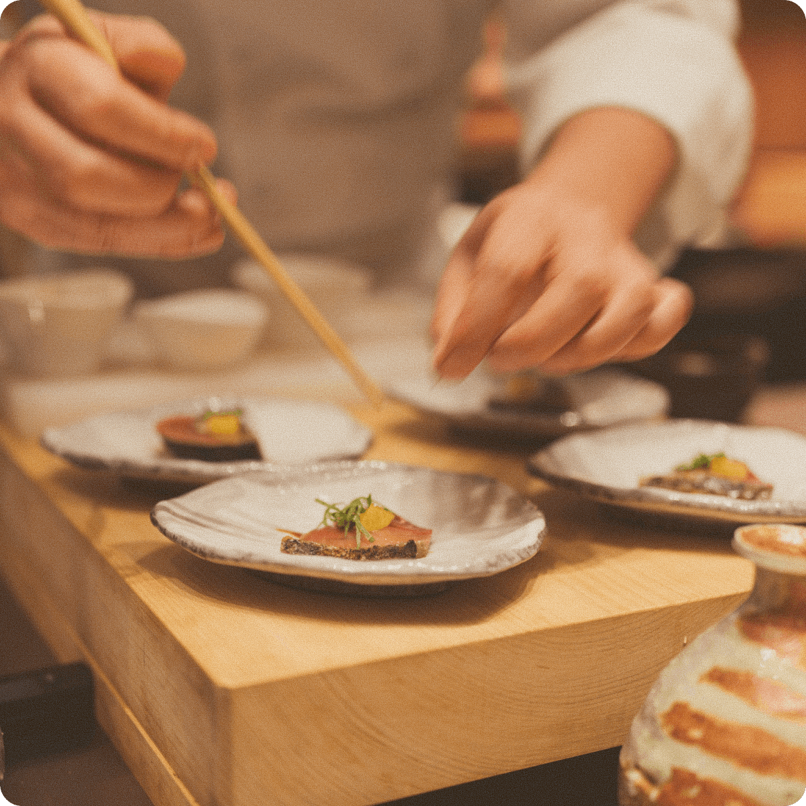 A restaurant team preparing and reviewing a menu